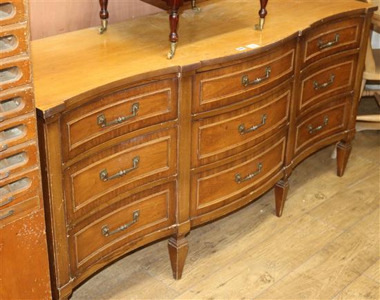 An American serpentine fronted nine drawer sideboard W.164cm